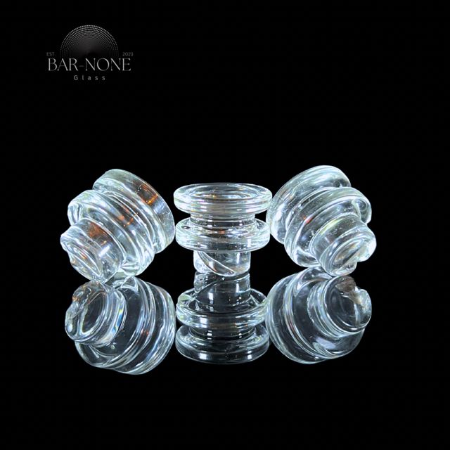 Gem Cup clear spinner caps from Bar None Glass: three clear stepped glass caps standing on a mirror
