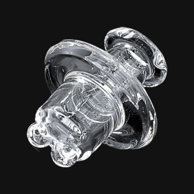 Kadabra Glass spinner cap: a clear glass cap with a wide flared disc and a hollow barrel body on a black background